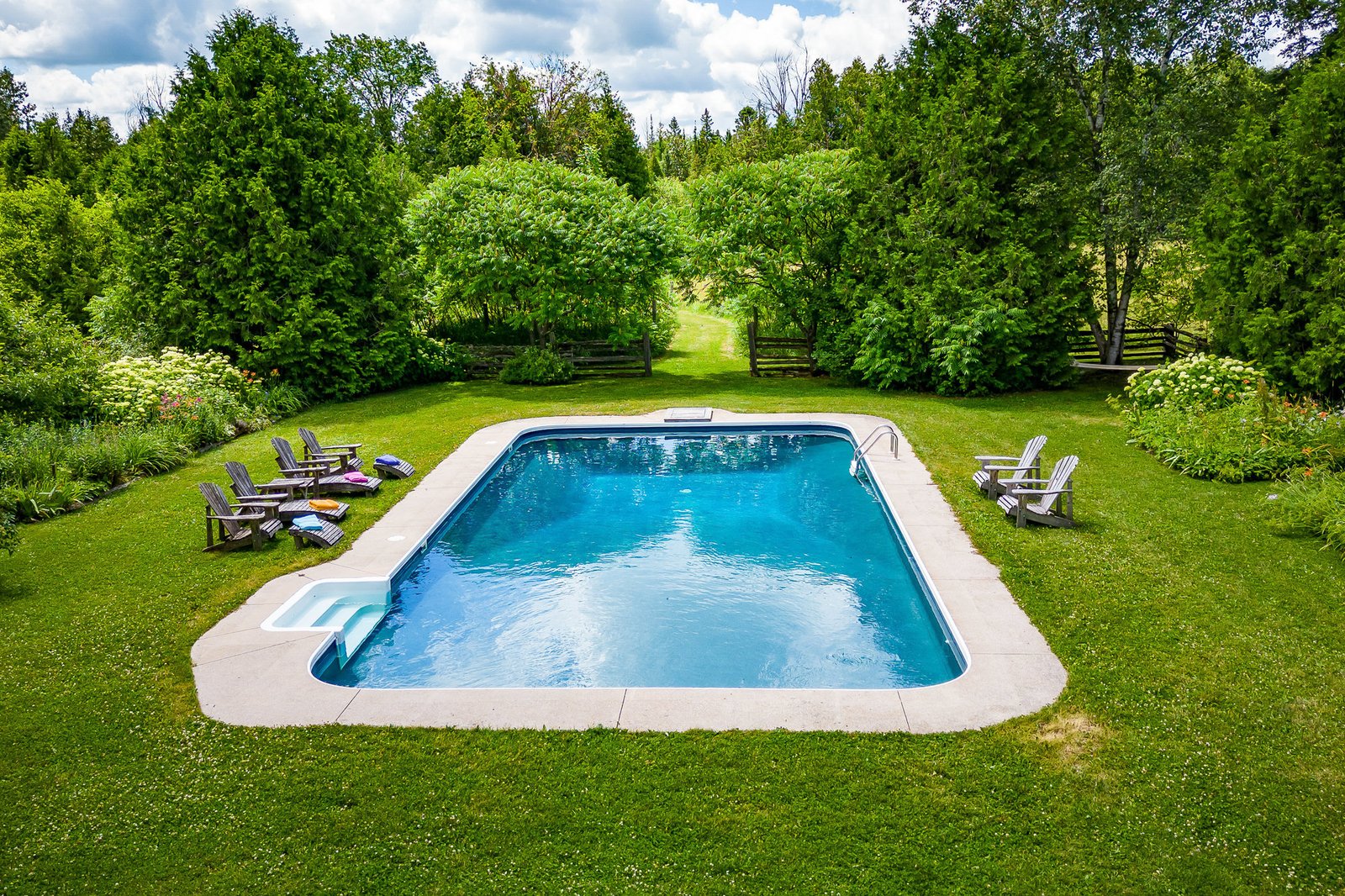 Pool surrounded by gardens
