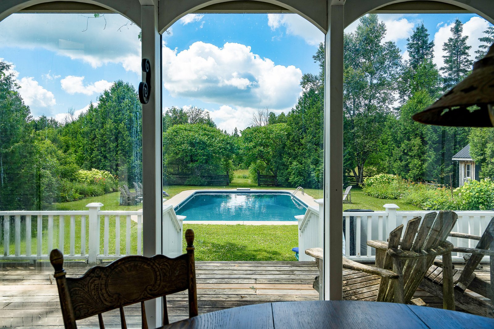 View from the farmhouse porch toward the pool